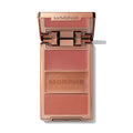 {Yacht Day} Cheek Thrills Multi-Finish Face Trio in Yacht Day, open compact showing matte blush, MORPHE-engraved shimmer, and satin blush pans in rosy nude tones, with MORPHE on the lid.
