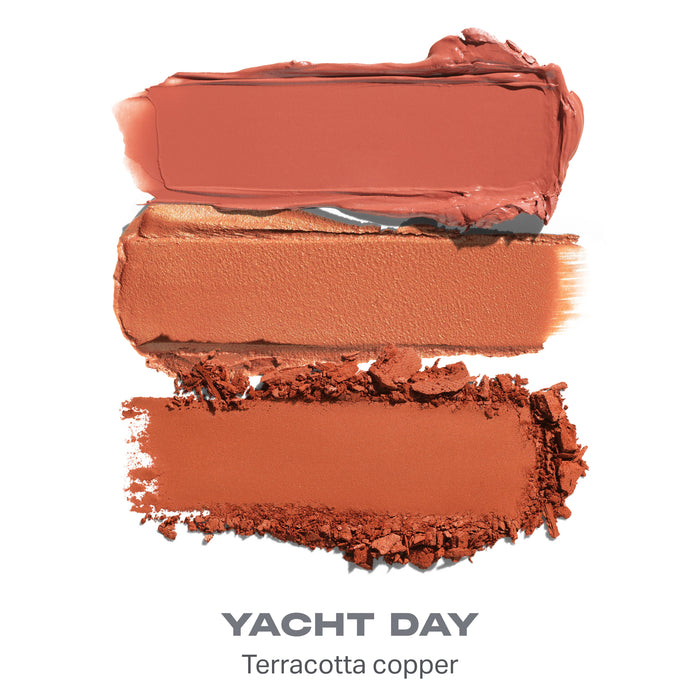 {Yacht Day} Cheek Thrills Multi-Finish Face Trio shade smear in Terracotta copper tones with text "YACHT DAY Terracotta copper."
