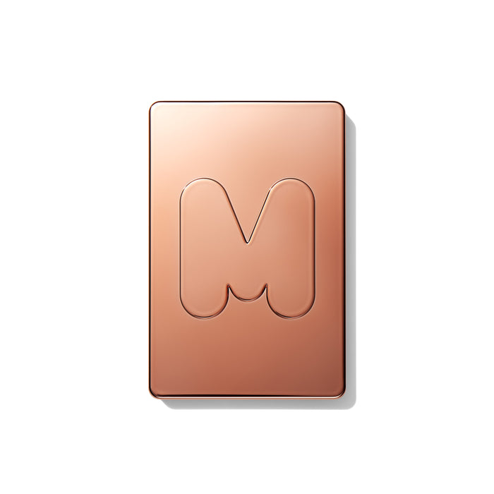 {Yacht Day} Cheek Thrills Multi-Finish Face Trio closed compact with rose-gold lid engraved with the Morphe M logo.