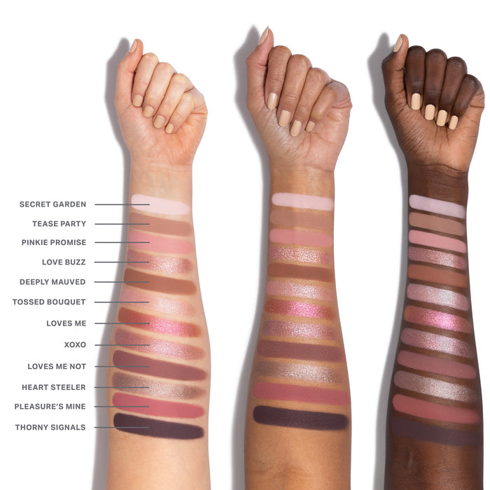 {Rose Frequency} Chromaplus 12 Pan Eyeshadow Palette arm swatches on three skin tones showing all 12 shades: Secret Garden, Tease Party, Pinkie Promise, Love Buzz, Deeply Mauved, Tossed Bouquet, Loves Me, XOXO, Loves Me Not, Heart Steeler, Pleasure's Mine, Thorny Signals.