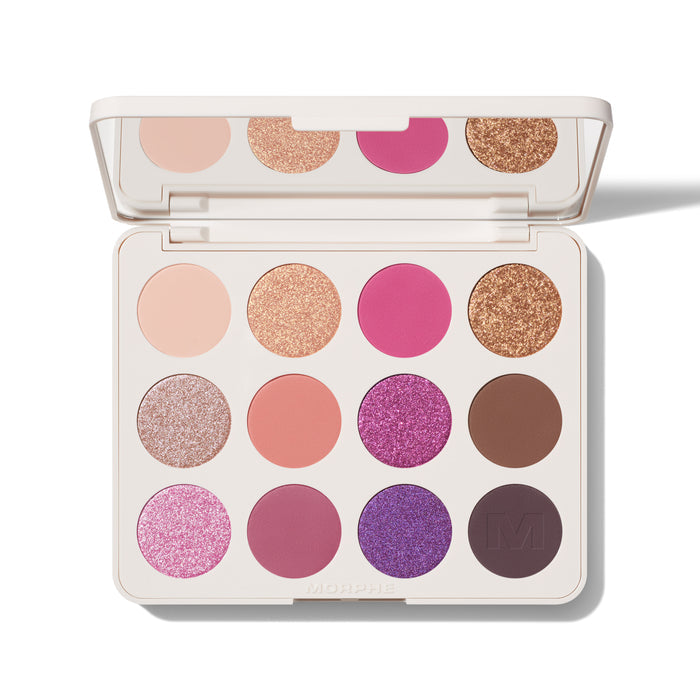{Electric Currant} Opened Morphe Chromaplus 12 Pan Eyeshadow Palette in cream case with mirror showing 12 shades: nude, rose gold glitter, hot pink, bronze glitter, pink glitter, coral, purple glitter, brown, pink shimmer, mauve, violet glitter, and deep plum with M logo; MORPHE engraved on case.