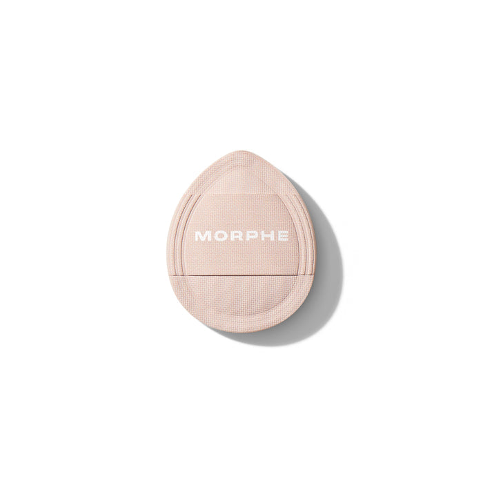 Morphe Cloud Cushion Seamless Puff applicator in pale pink with woven texture, back view showing white MORPHE wordmark.