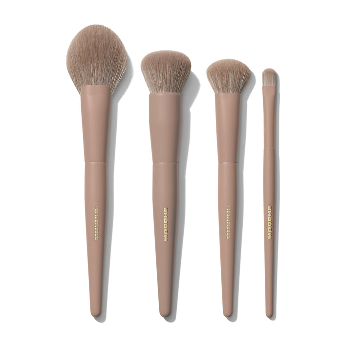 Morphe Iced Mocha 4-Piece Face Brush Set flat lay showing four brushes in graduated sizes with mocha taupe handles and gold foil lettering
