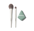 Morphe Conceal & Set Tool Trio featuring two white-handled brushes labeled MORPHE with gray bristles and a sage green diamond sponge labeled MORPHE.
