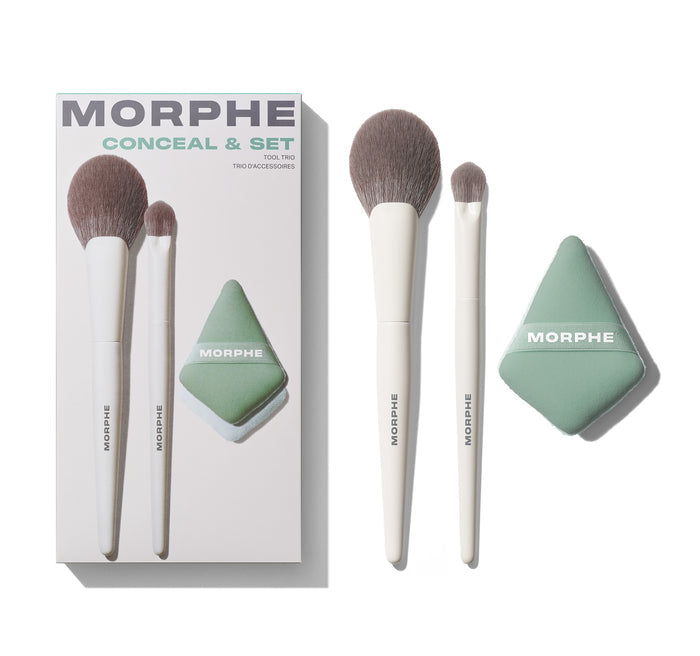Morphe Conceal & Set Tool Trio box labeled "MORPHE CONCEAL & SET TOOL TRIO TRIO D'ACCESSOIRES" displayed beside two white-handled MORPHE brushes and a green diamond MORPHE sponge.