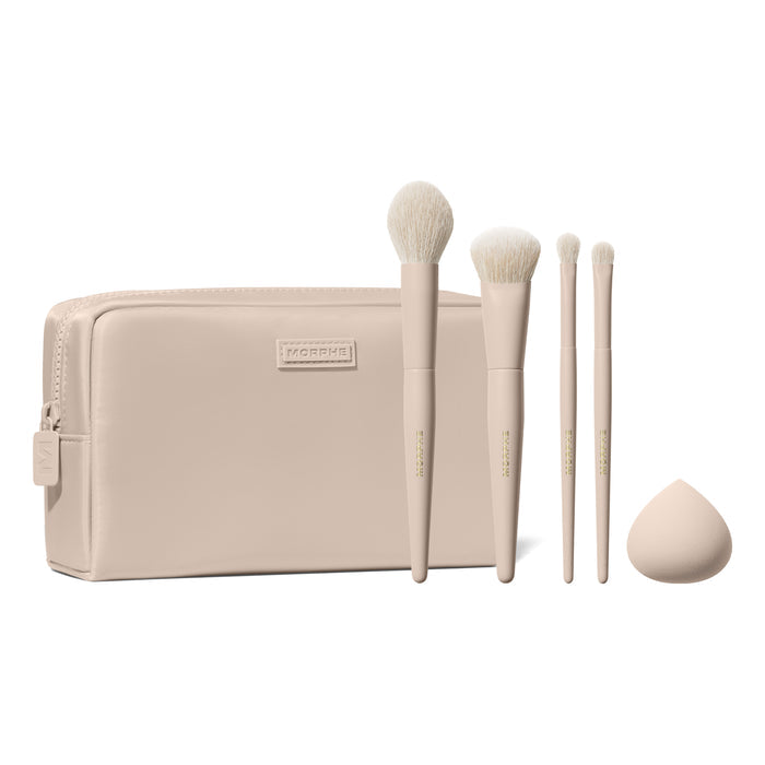 Morphe Iced Oat Latte Custom Blends 5-Piece Brush Set fanned out of beige makeup bag with eyeshadow swatch and beauty sponge
