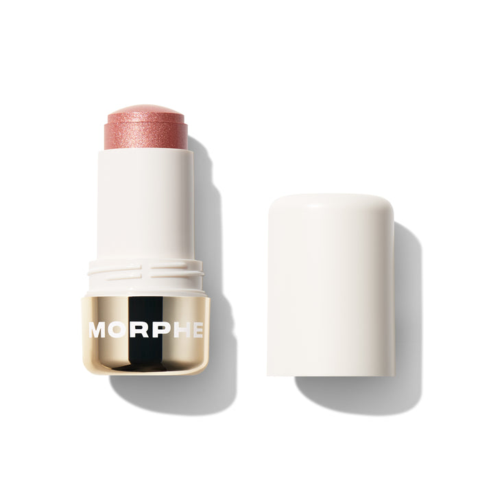 {Rose Spritz} Morphe Dreamlight Gelee Highlighter Stick in a shimmery rose pink shade, open with cap beside it, MORPHE on gold band.