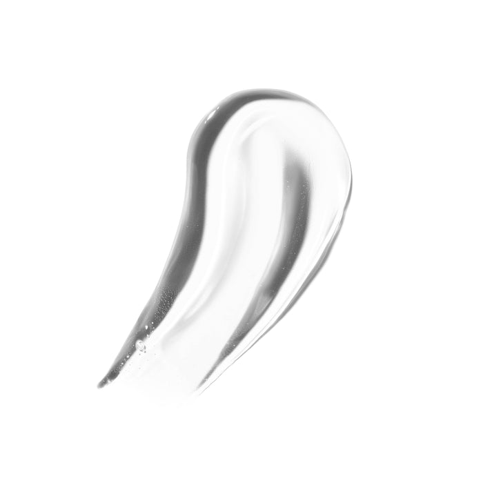 Clear glossy swatch of Morphe Dripglass Crystal Super Shine Lip Gloss smeared on white background, showing high-shine, non-tacky finish.