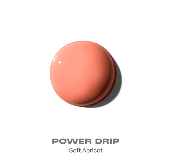 {Power Drip} Morphe Hot Shot Blush Drops smear swatch in shade Power Drip — Soft Apricot, a glossy peachy-coral drop on white.