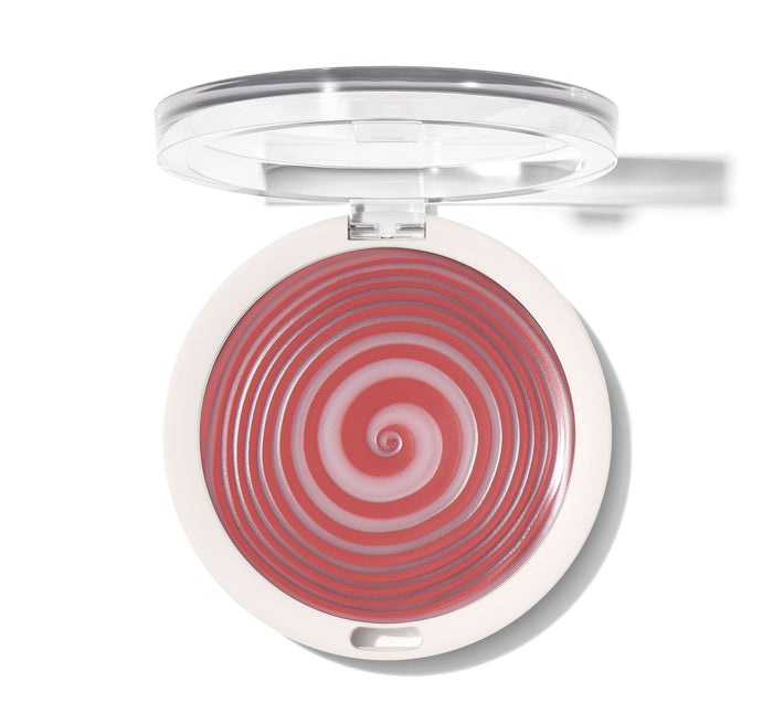 {Hypnotized (rose terracotta)} Open compact of Huephoric Rush 3 In 1 Silk Blush showing a concentric spiral swirl in deep rose and terracotta tones with a clear lid.
