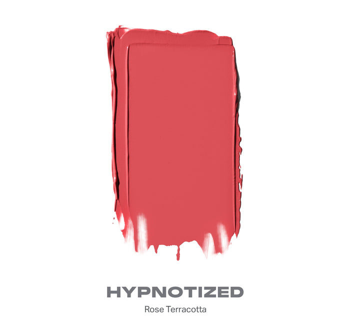 {Hypnotized (rose terracotta)} Huephoric Rush 3-In-1 Silk Blush swatch labeled HYPNOTIZED, Rose Terracotta, coral-rose color with brushstroke texture.