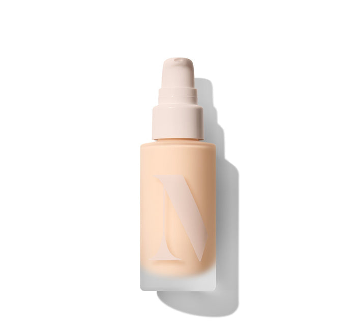 {Light 02N} Lightform Extended Hydration Foundation pump bottle in shade Light 02N, peachy-toned frosted base with embossed L logo, white pump cap, studio shot.
