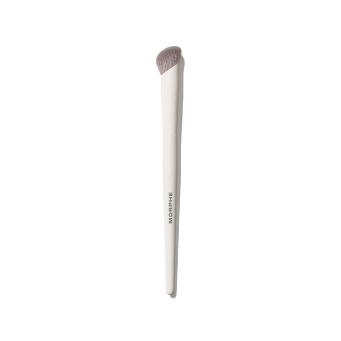 Morphe M132 Angled Concealer Brush with white handle labeled MORPHE and taupe synthetic angled bristles on white background.