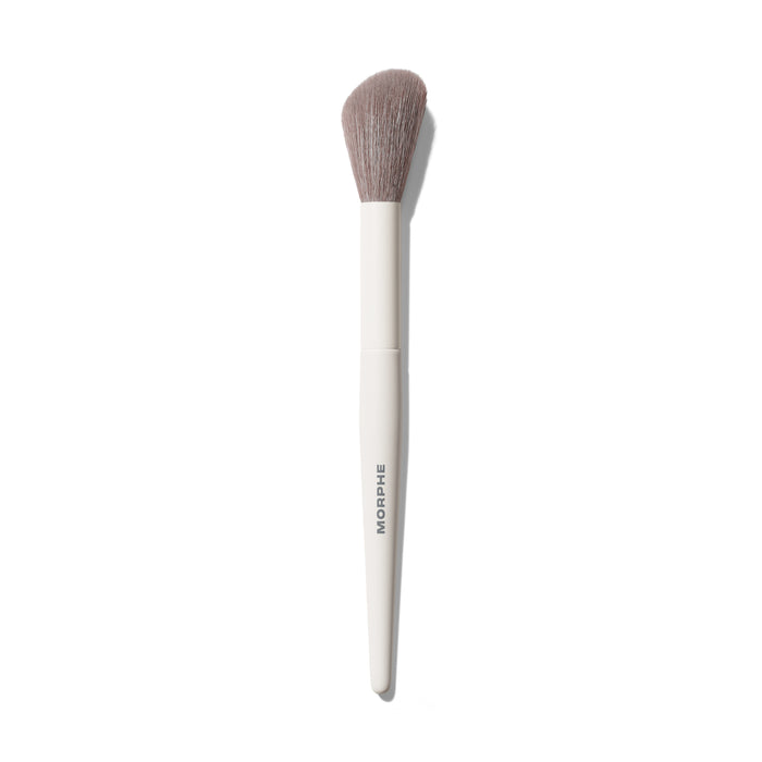 Morphe M201 Angled Powder Blush Brush with cream handle printed MORPHE and tapered gray bristles, shown on white background.