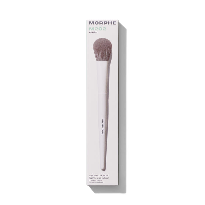 M202 Slanted Blush Brush in white retail box. Embedded text: "MORPHE M202 BLUSH SLANTED BLUSH BRUSH PINCEAU BLUSH INCLINE CONTAINS 1 BRUSH / CONTIENT 1 PINCEAU"
