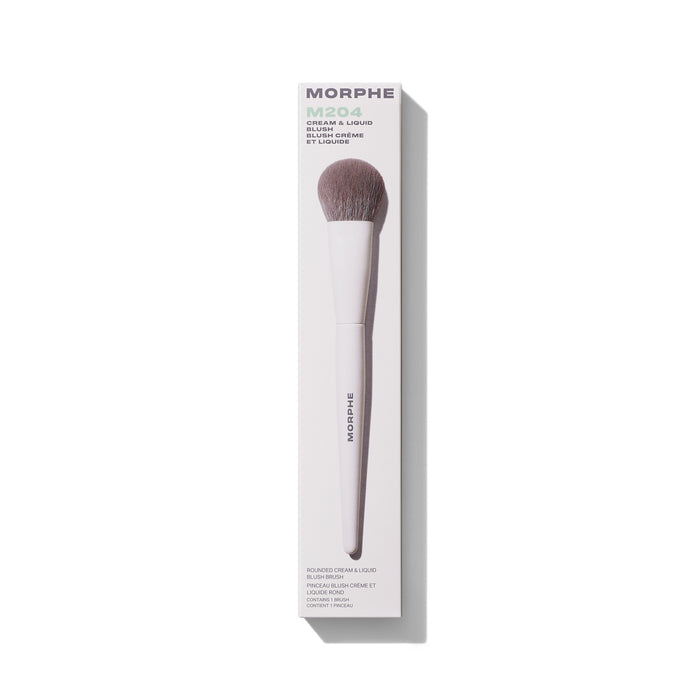 Morphe M204 Rounded Cream & Liquid Blush Brush in white box packaging labeled "MORPHE M204 Cream & Liquid Blush / Blush Crème et Liquide," with white handle and taupe dome bristles.