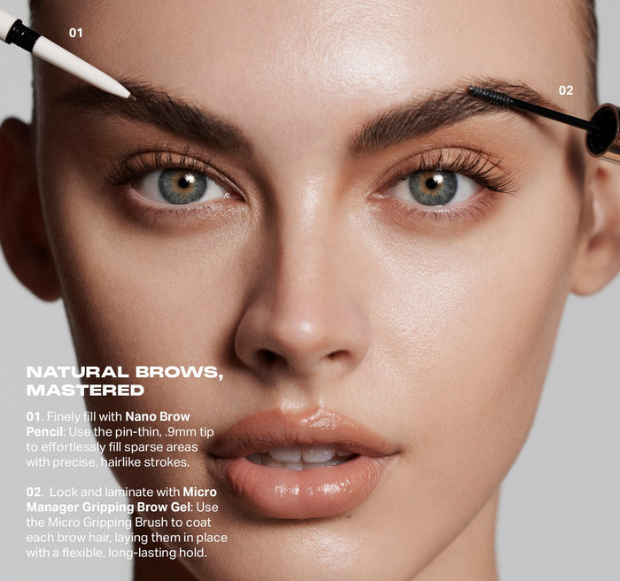 Model applying Micro Manager Gripping Brow Gel with spoolie brush; text reads NATURAL BROWS, MASTERED — 01. Finely fill with Nano Brow Pencil: Use the pin-thin, .9mm tip to effortlessly fill sparse areas with precise, hairlike strokes. 02. Lock and laminate with Micro Manager Gripping Brow Gel: Use the Micro Gripping Brush to coat each brow hair, laying them in place with a flexible, long-lasting hold.