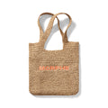 Morphe Raffia Tote Bag in Orange — woven natural raffia tote with orange embroidered MORPHE logo on the front.