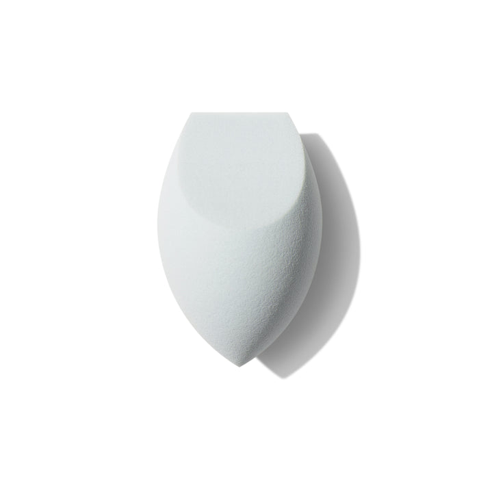 Morphe One Done Multifunctional Makeup Sponge, a white dual-sided flat-edge and rounded porous blending sponge on a white background.