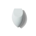 Morphe One Done Multifunctional Makeup Sponge, a white dual-sided flat-edge and rounded porous blending sponge on a white background.