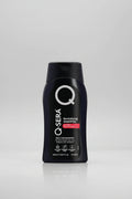 A black plastic bottle of Q-Sera Revitalizing Shampoo with a black cap, featuring white and red text on the front label.