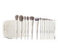 Morphe Ready Set Pro 16 Piece Face & Eye Brush Set displayed with 16 MORPHE-stamped white-handle brushes fanned out beside a cream ribbed zip bag.