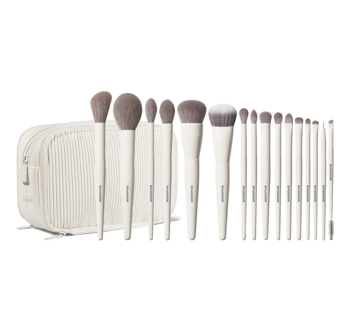 Morphe Ready Set Pro 16 Piece Face & Eye Brush Set displayed with 16 MORPHE-stamped white-handle brushes fanned out beside a cream ribbed zip bag.