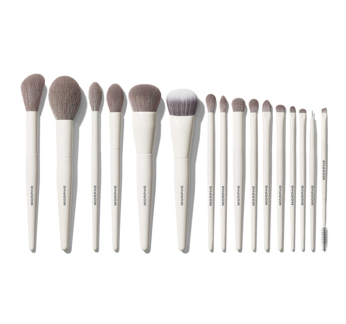 Morphe Ready Set Pro 16-Piece Face & Eye Brush Set fanned out on white, all 16 MORPHE-stamped white-handle brushes displayed from largest face to smallest eye brush.
