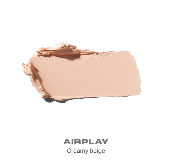 {Airplay} Swatch of Solo Artist Priming Cream Eyeshadow shade AIRPLAY — Creamy beige, shown as a smeared cream texture swatch.